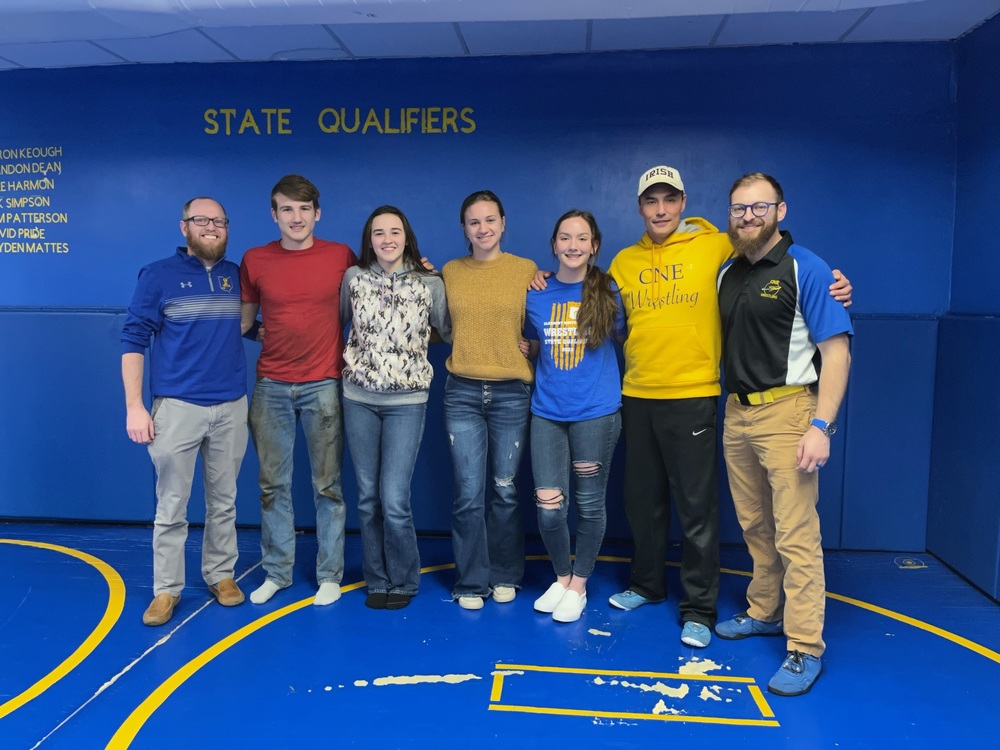 Clermont Northeastern’s state wrestling contingent, from left: coach Scott Wells, senior Colby Johnson, freshman Liberty Johnson, junior Jessie Foebar, freshman Janelle Donahue, girls coach Tom Donahue and assistant coach Taylor Shinkle. (Photo by Dick Maloney.)
