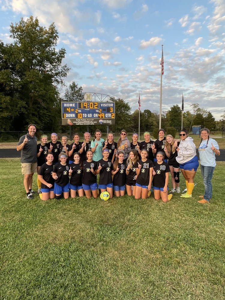 Clermont Northeastern’s girls soccer team poses under the scoreboard after defeating the Wildcats 4-3 Oct. 6 to win the Southern Buckeye Athletic and Academic Conference National Division championship. (Photo courtesy T.J. Buckley.)