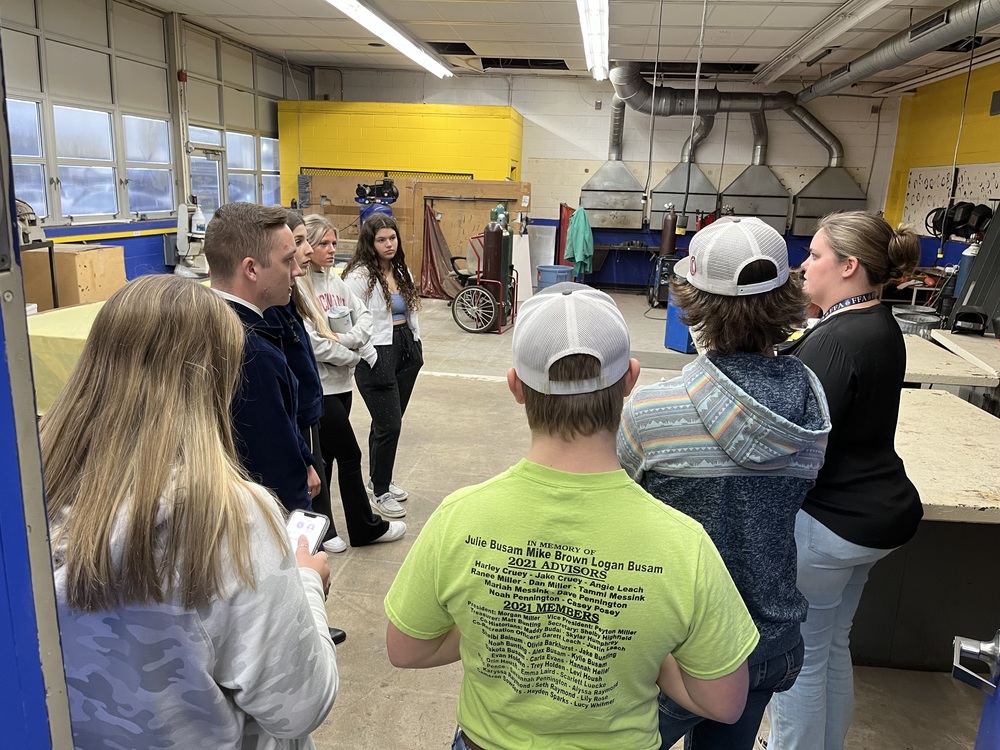Clermont Northeastern agricultural education teacher Faith Stegbauer (right) talks about the FFA workshop with students and national FFA officers. (Photo by Dick Maloney.)