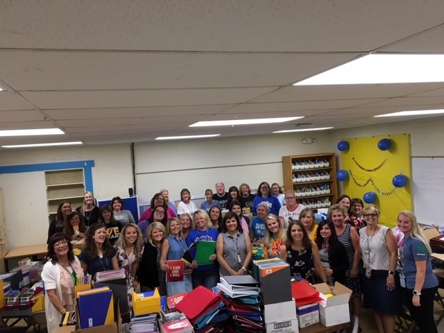 Clermont Northeastern Elementary School staff members with just a portion of the supplies donated to the school through the “Stuff the Bus” program.