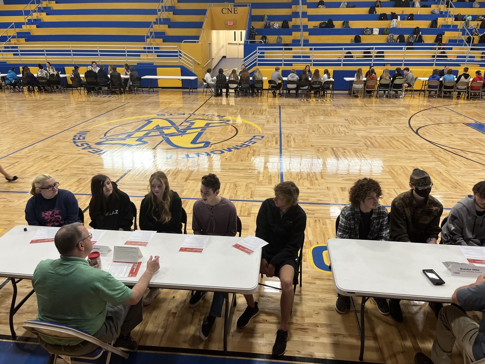 Tables were set up around the gym floor at Clermont Northeastern High School’s speed mentoring event April 14. (Photo by Dick Maloney.)
