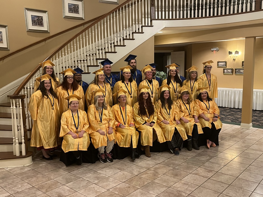 Members of the most recent class of Adult 22-Plus graduates gather for a group photo before ceremonies Jan. 24 at Norlyn Manor. (Photo by Dick Maloney.)