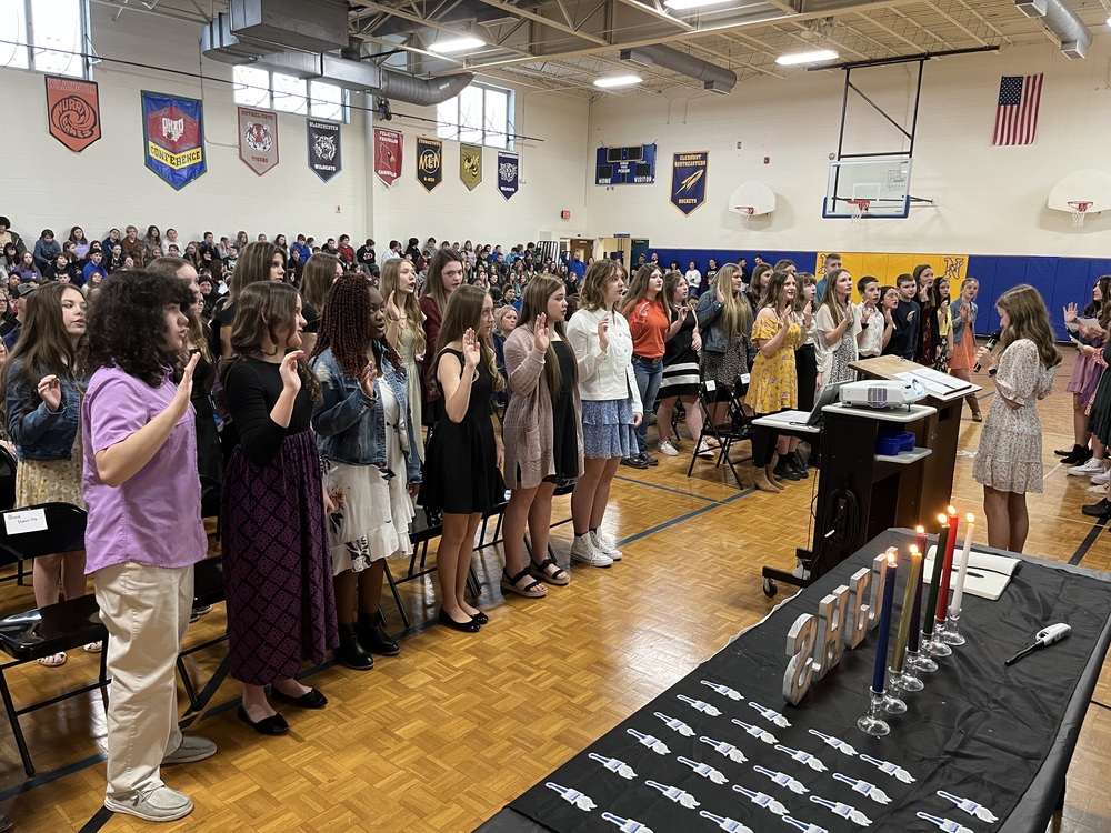 The newest members of Clermont Northeastern Middle School’s National Junior Honor Society chapter take their oaths during ceremonies March 2 at the school. (Photo by Dick Maloney.)