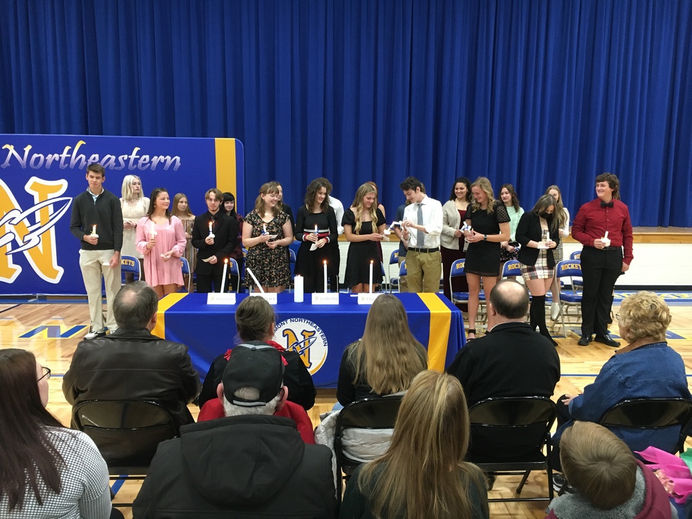 Clermont Northeastern High School National Honor Society inductees light candles during ceremonies at the school Dec. 3. (Photo by Dick Maloney.)