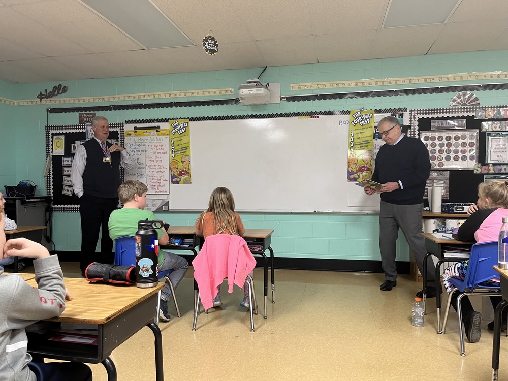 Rotary Club of Batavia president Harry Snyder and incoming President Victor Kubik read to third-graders at Clermont Northeastern Elementary School. (Photo by Dick Maloney.)