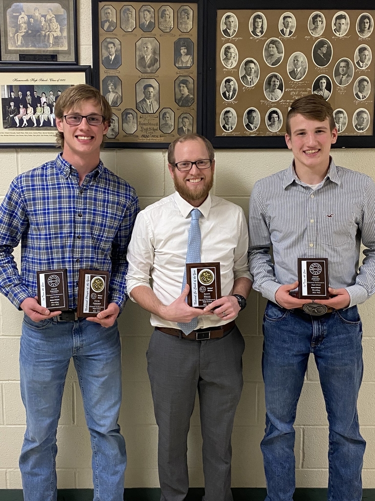 Clermont Northeastern wrestlers Jacob Groeber, left, and Colby Johnson, right, won Southern Buckeye Athletic and Academic Conference titles. Coach Scott Wells was named SBAAC National Division Coach of the Year.