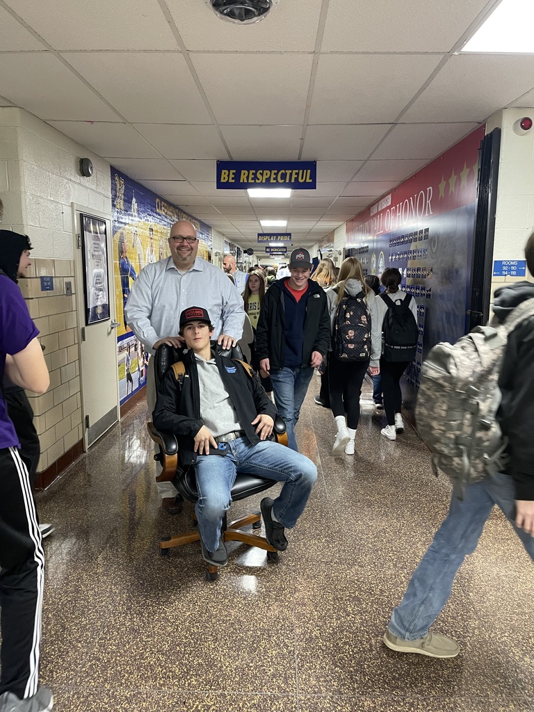 Junior Braydin Pride cashed in the prize he won during the 1st Quarter Referral Assembly.  Mr. Houp used his office chair to happily push Braydin between classes today.
